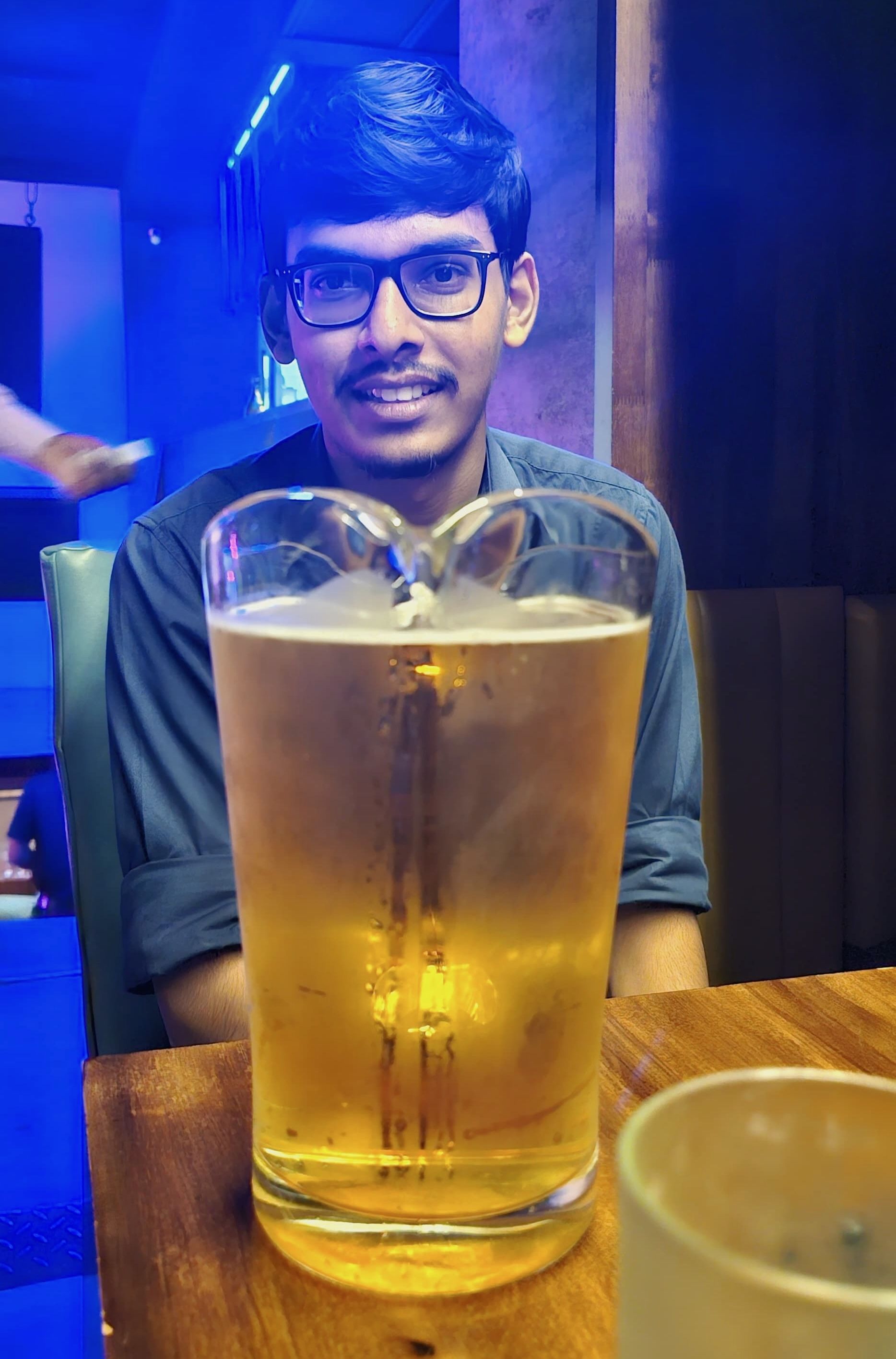 Me sitting if front of a pitcher full of beer